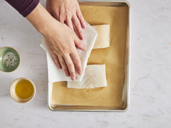 prepping raw halibut 