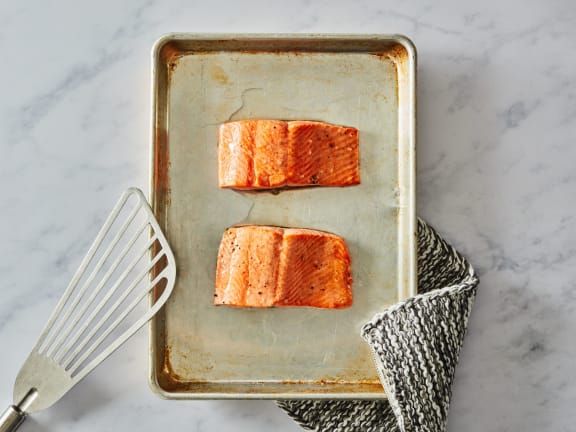 broiled salmon flaked with vegetables