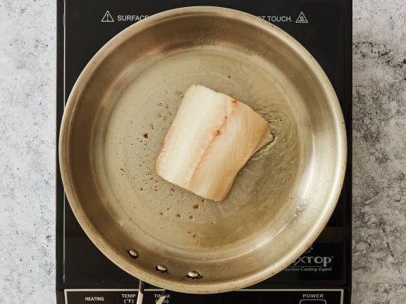 sablefish frying in pan with oil