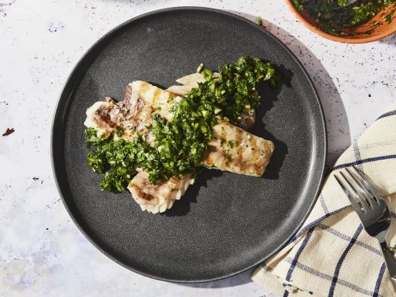 grilled pacific rockfish fillets with green sauce on a plate