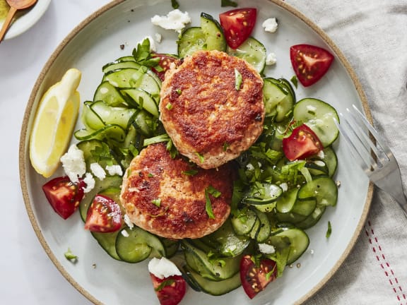 salmon patties on salad greens