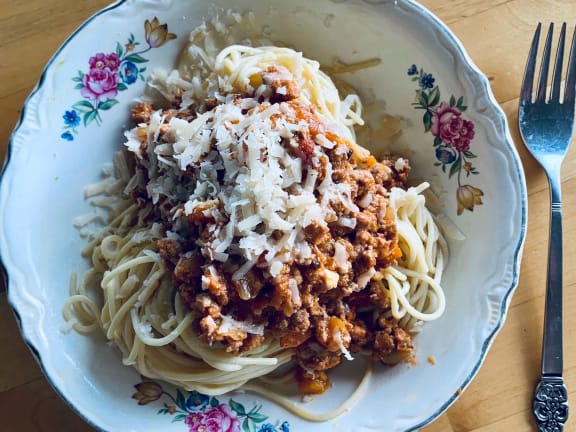 bowl of pasta bolognese with sockeye salmon