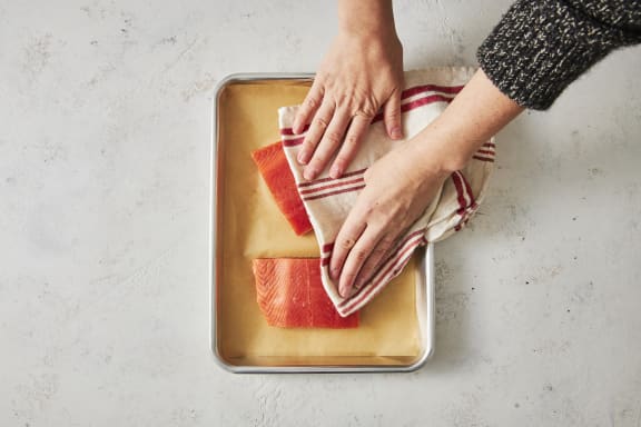 prepping raw coho salmon