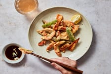 sockeye salmon tempura on a plate with a side of soy sauce