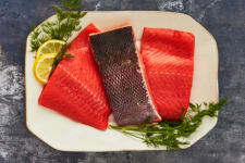 raw sockeye salmon fillets on plate