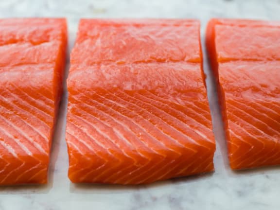 Raw salmon on marble cutting board for instant pot