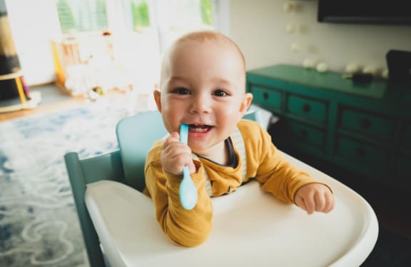 baby eating spoon