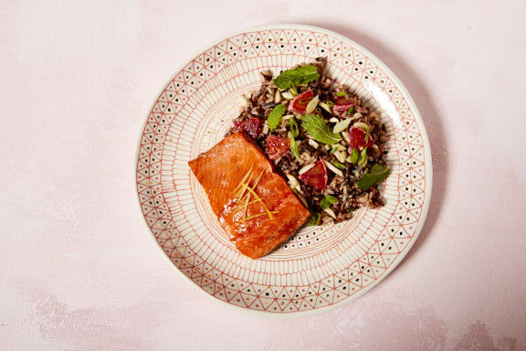 healthy salmon plated with rice salad