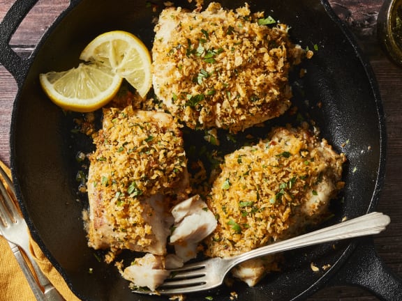 panko fish in casserole dish with sun dried tomato pesto