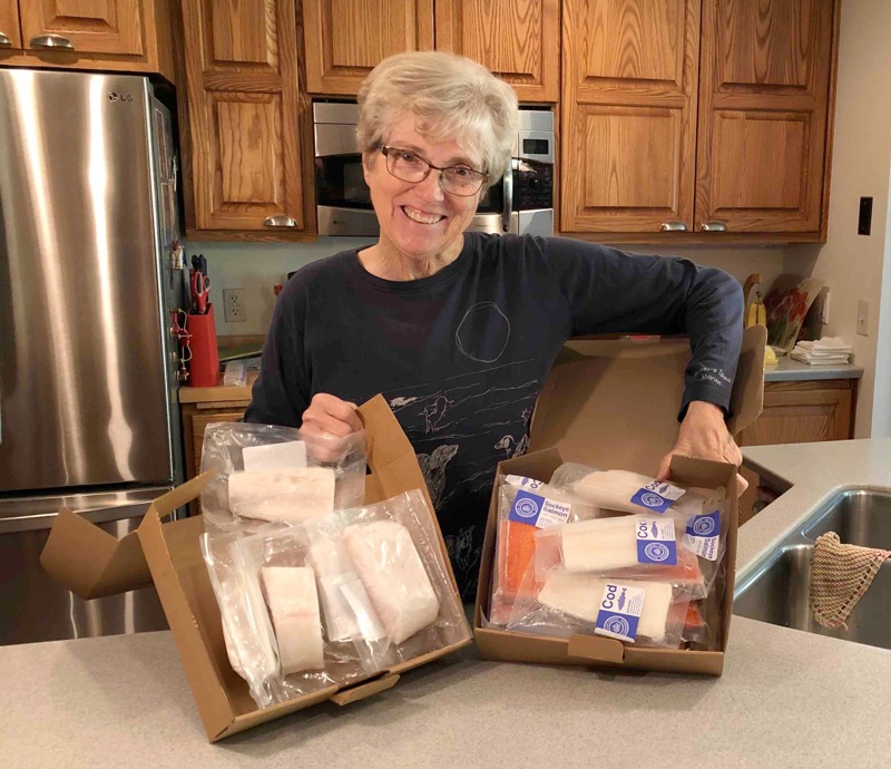 Photo of Susan K. smiling next to her order