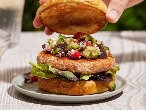 Greek-Style Grilled Salmon Burgers with Feta, Olive, Tomato Topping