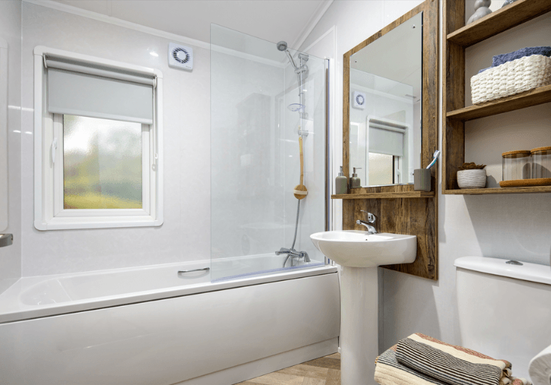 The Willerby Boston bathroom with dark oak effect units and an optional bathtub.