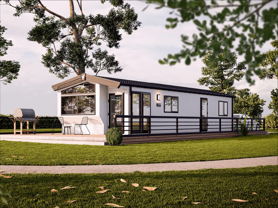 The Willerby Castleton exterior in white with brown decking sited on a grassy park.