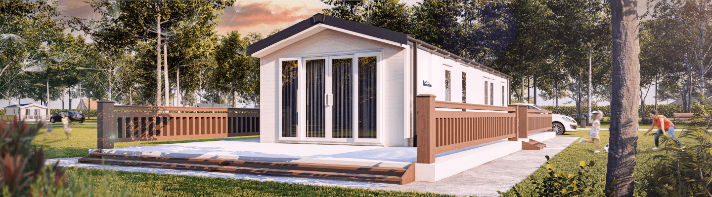 The Willerby Malton exterior in white with oak and white decking surrounded by a forest.