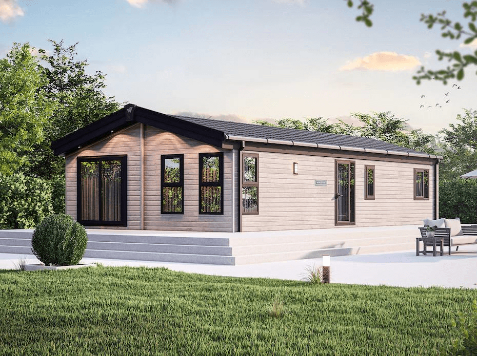 The Willerby Mapleton exterior with white decking on a field. 