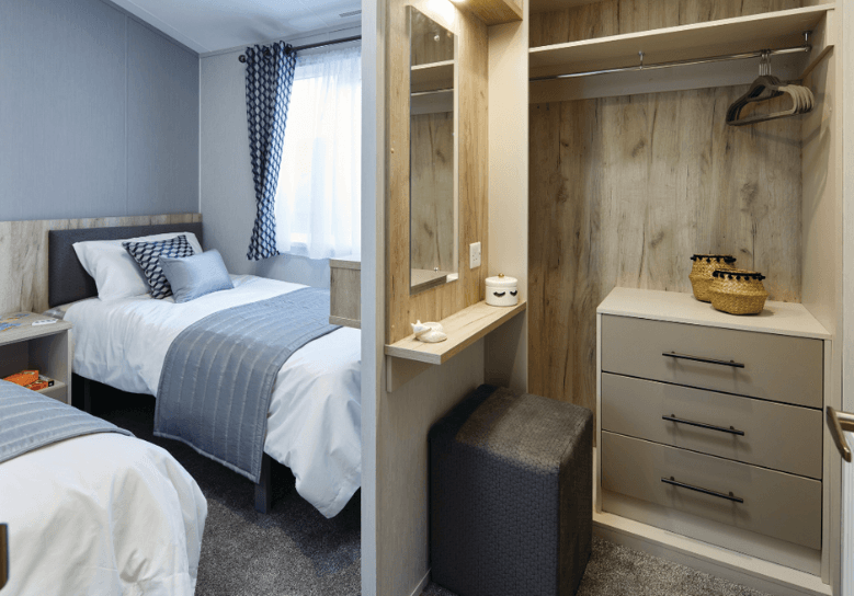 The Willerby Mapleton twin bedroom has an open dressing area as you walk into the room with matching oak effect bedside tables.