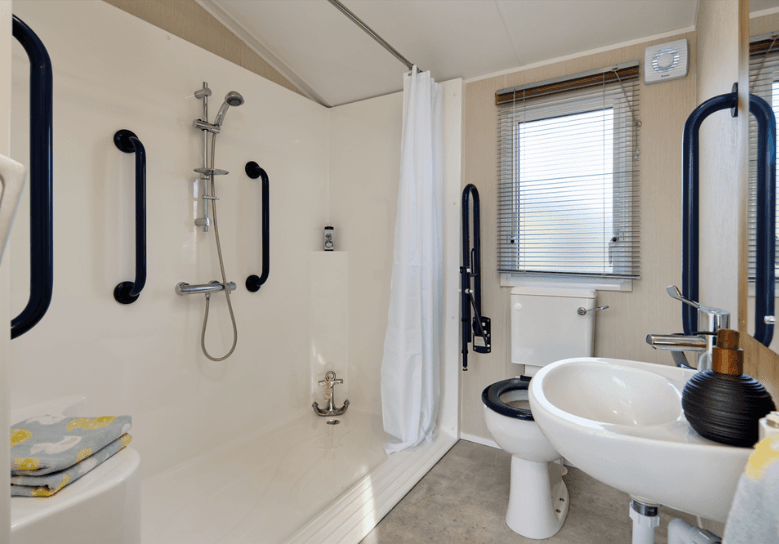 The Willerby Richmond bathroom has an accessible shower pod with plenty of grab rails.