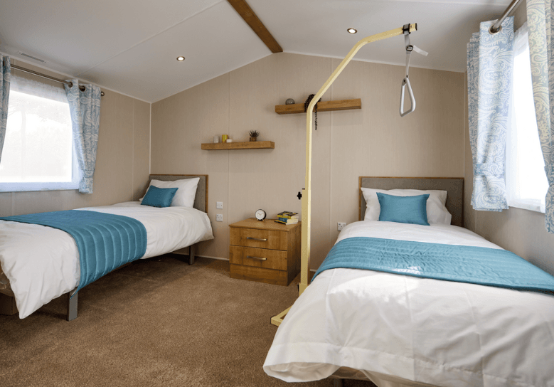 The Willerby Richmond main bedroom has two single beds in a spacious room, and a lifting aid.