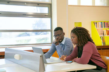 Couple doing presentation for studies in classroom; Photo by Kampus Production from Pexels