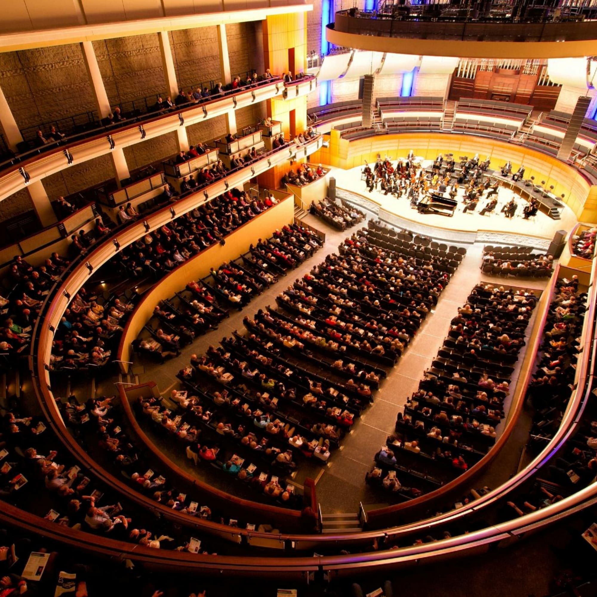 The Edmonton Symphony Orchestra on the Winspear Stage with a captivated audience filling the hall.