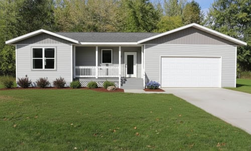 Gray ranch-style modular home with white trim, front porch, and attached garage by Wisconsin Homes.