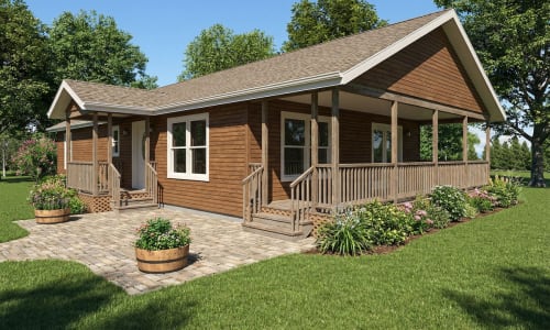 Wood-tone cottage-style modular home by Wisconsin Homes in Marshfield, WI with wraparound porch and paver patio.