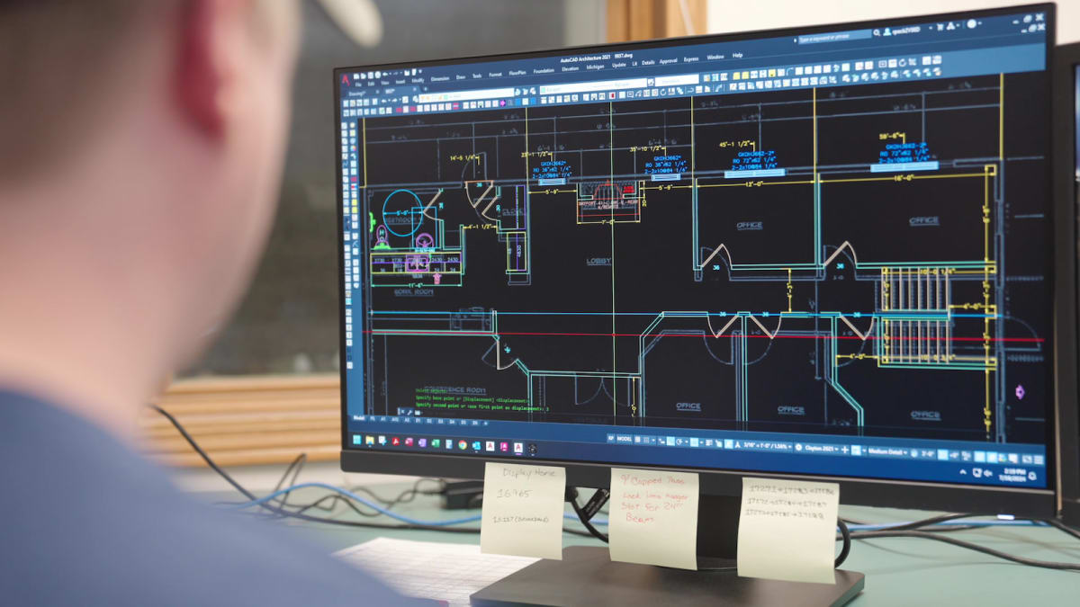 Computer screen displaying a detailed CAD floor plan design for a modular home at Wisconsin Homes.