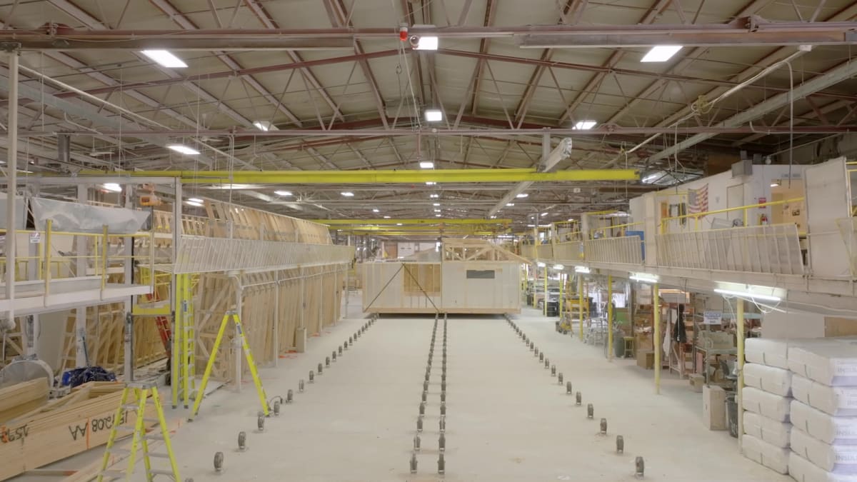Interior of Wisconsin Homes manufacturing facility showing modular home construction in progress.