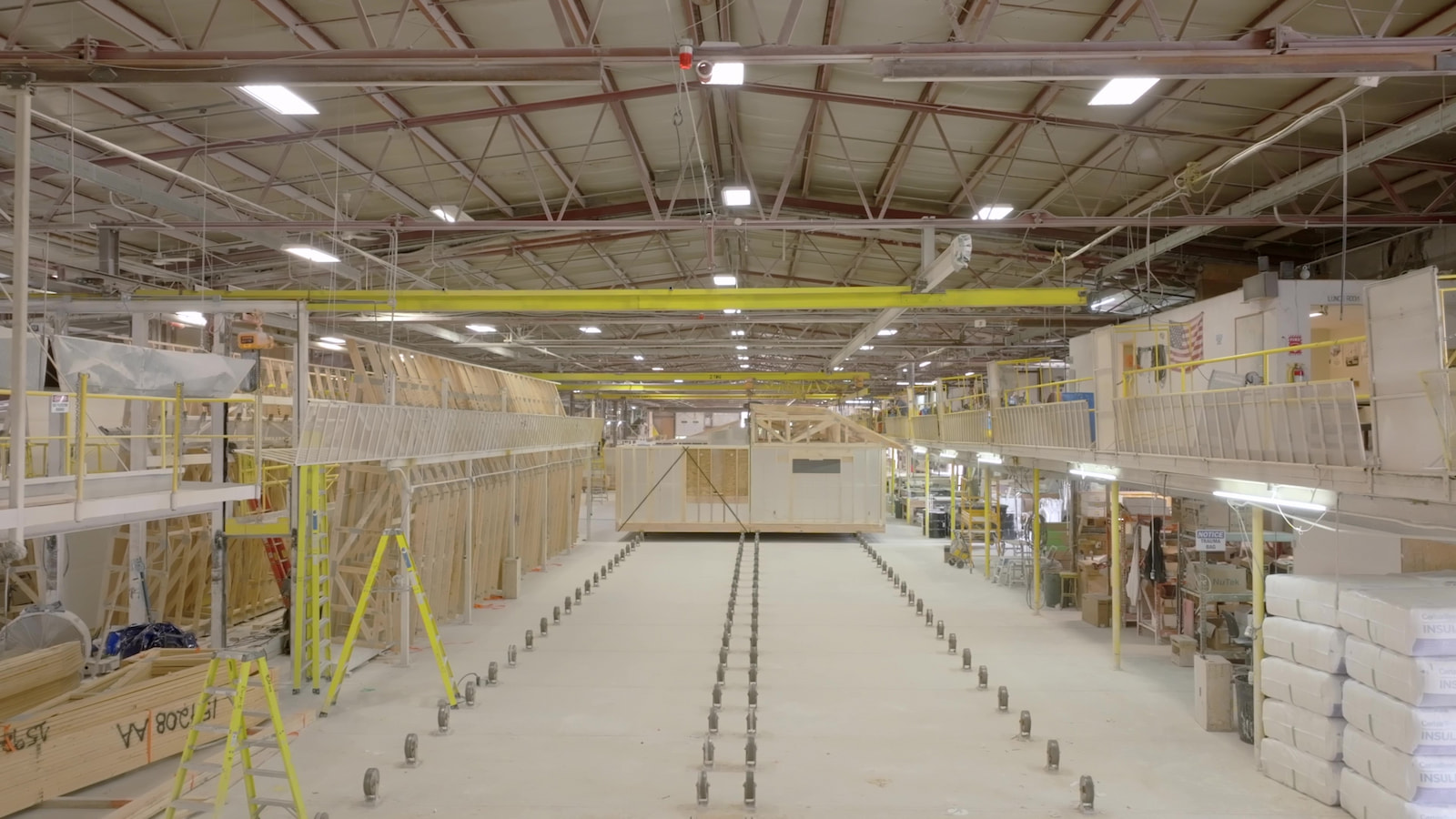 Interior of Wisconsin Homes manufacturing facility showing modular home construction in progress.