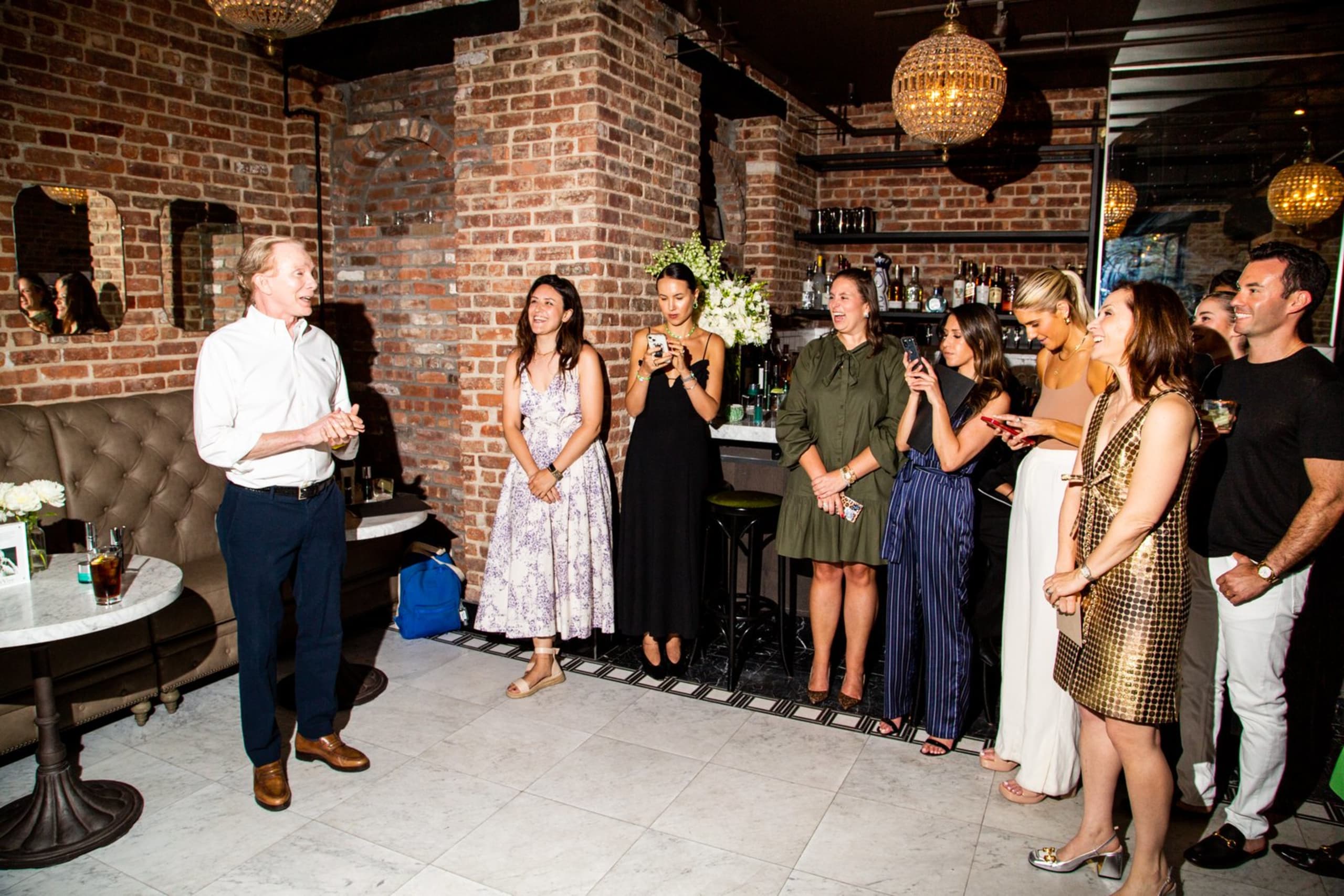 Guests gathered at the bar during a private party