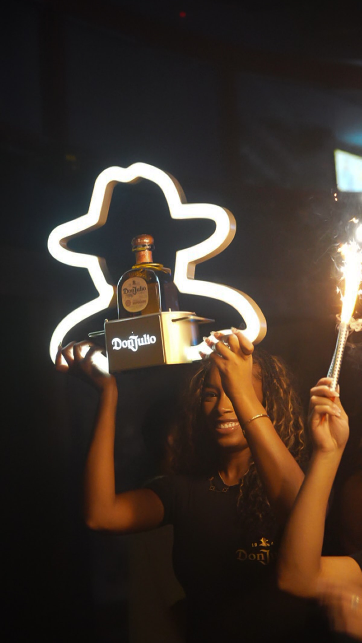 Don Julio 1942 bottle presentation in a lit frame