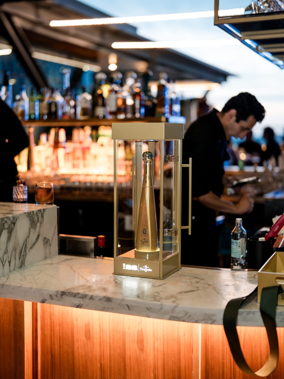 Back bar with the gold Don Julio display