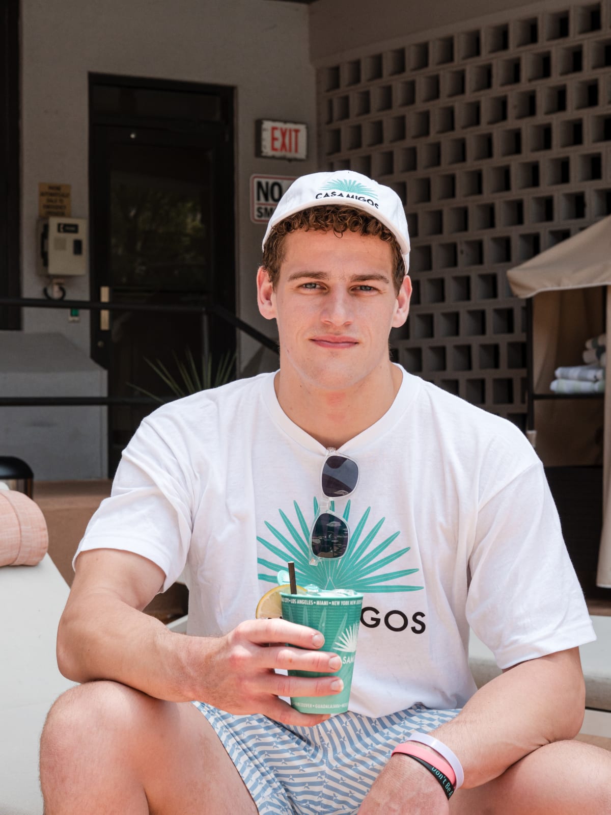 Guest in a Casamigos tee holding a cup