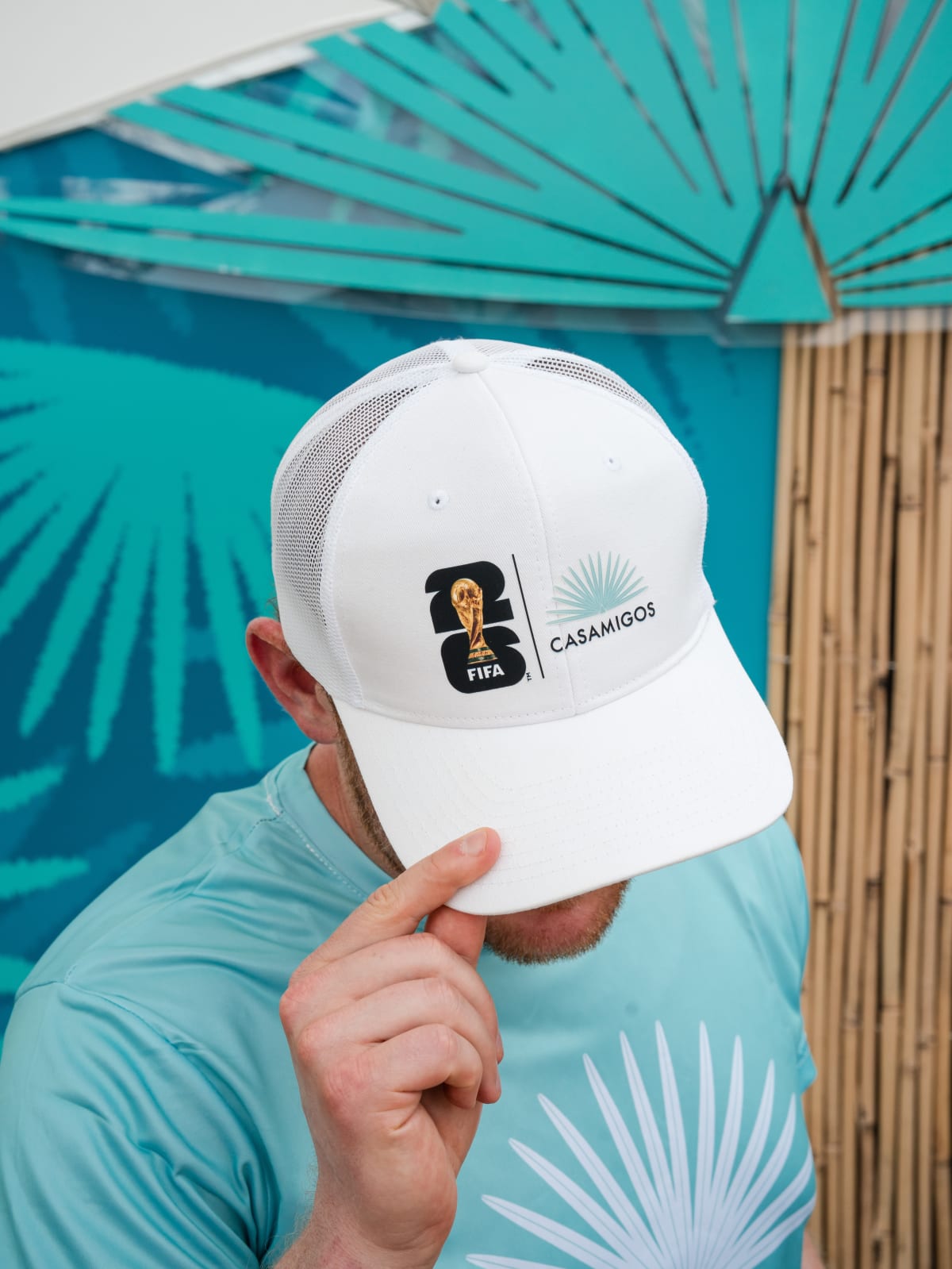 Casamigos brand ambassador in a teal tee and white cap