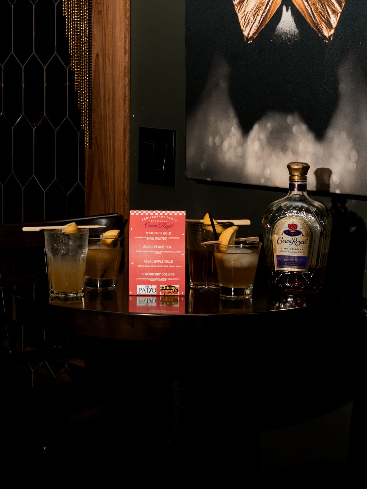 Crown Royal bottle and signature serves on a lounge table