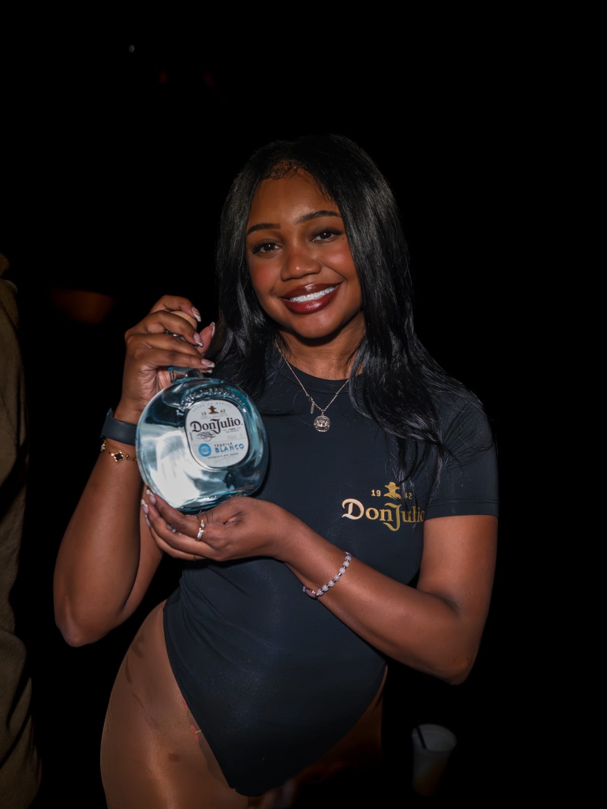 VIP bottle server presenting a Don Julio Blanco bottle