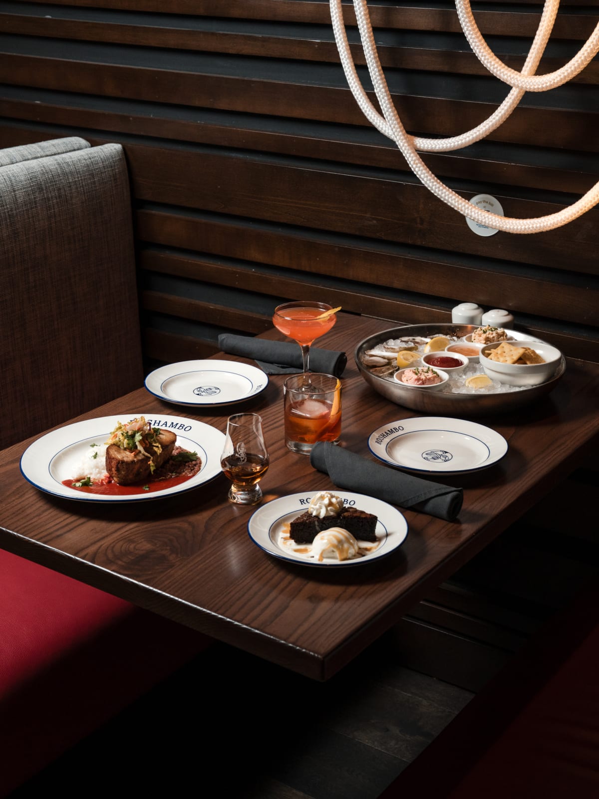 The full pairing spread across the table under pendant lights