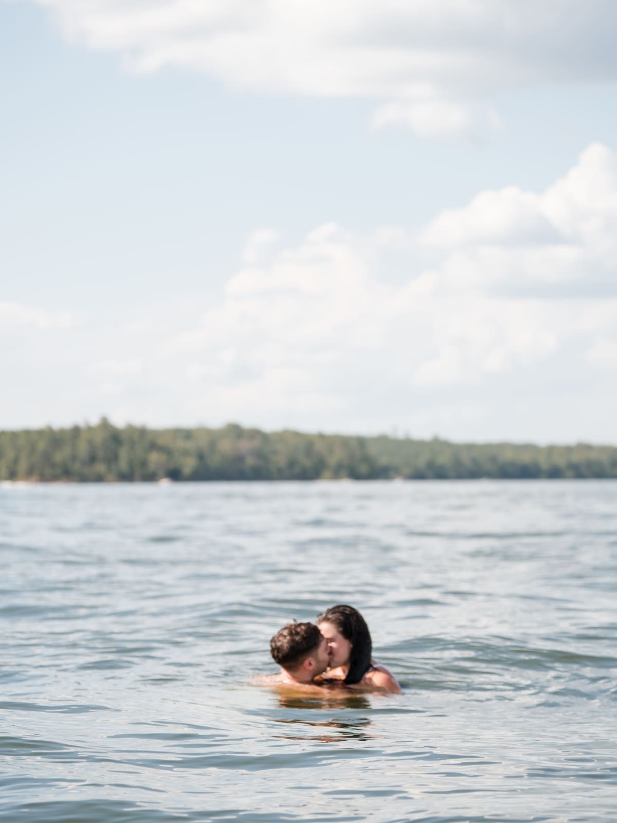 A couple treading water far out on Lake Sinclair