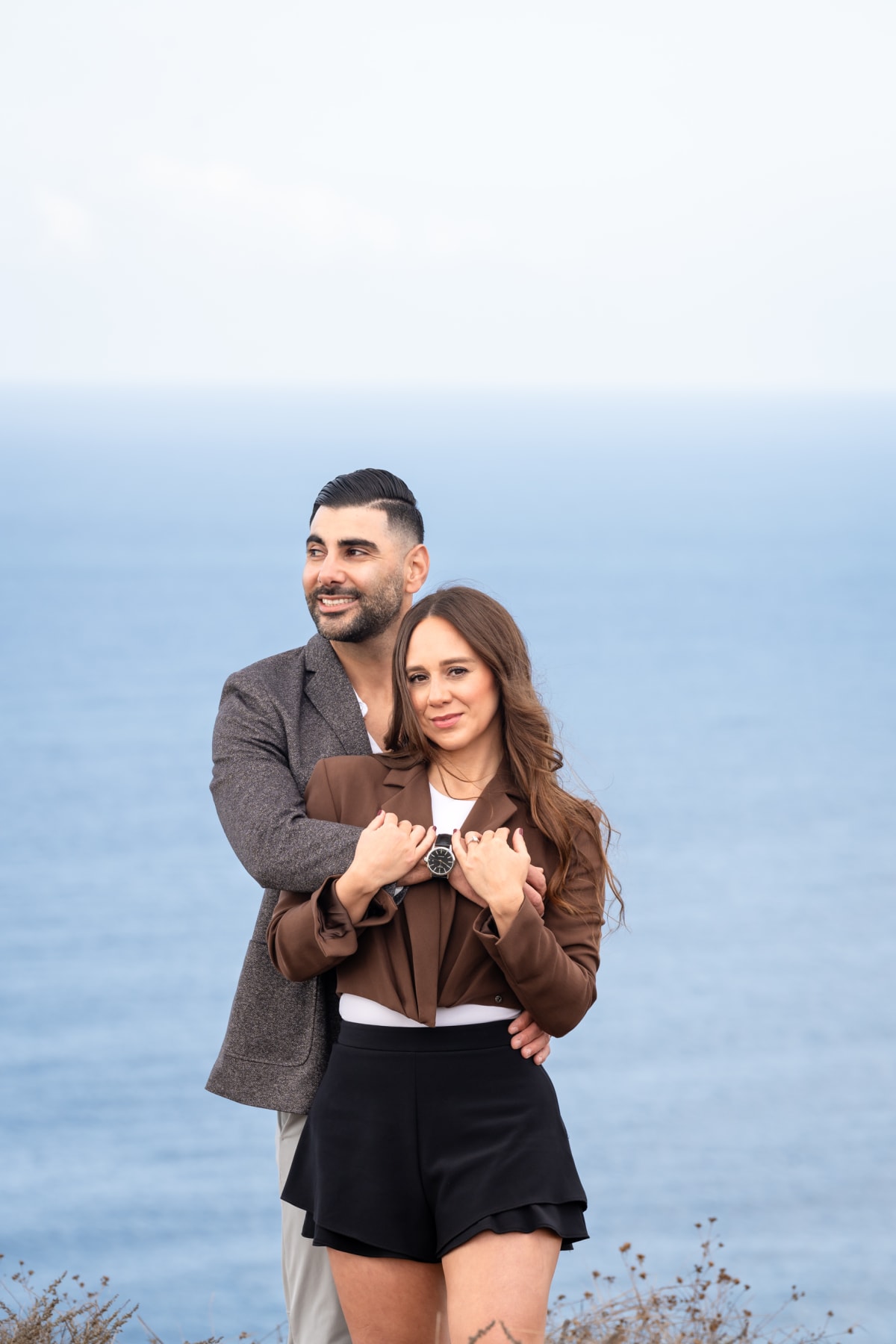 Alexa laughing against Ninos during their engagement session