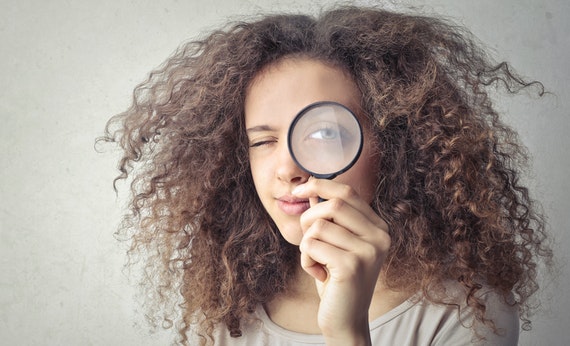 Woman with magnifying glass