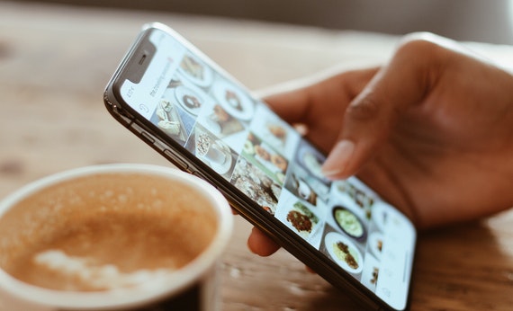 Selective focus photography of person using iphone x