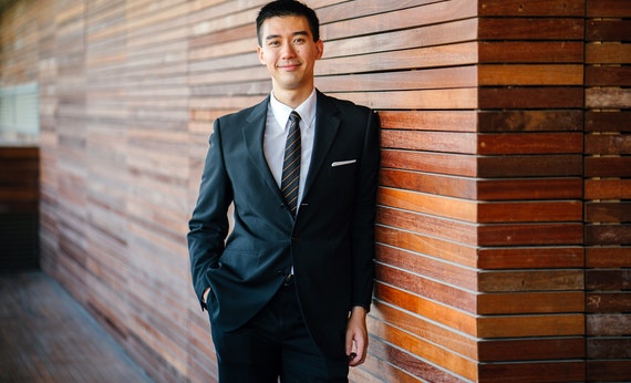 Men wearing black suit jacket and pants