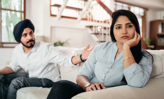 Young indian couple having quarrel at home