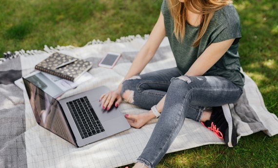 student doing home assignments on laptop