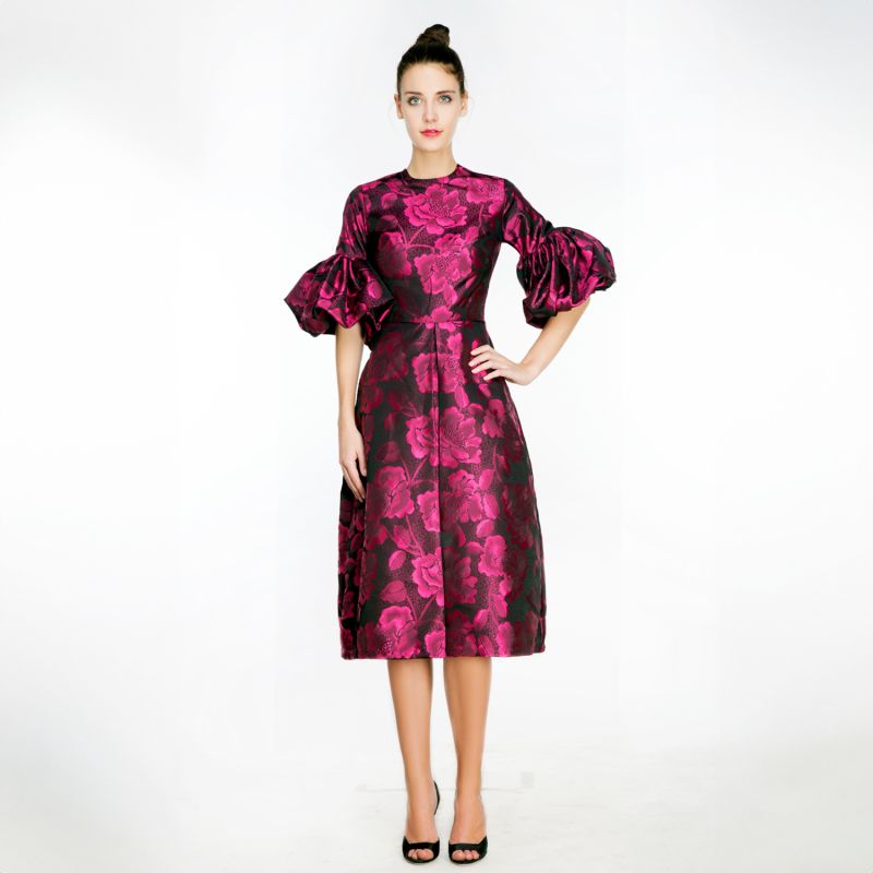 A Pleated Dress With Pink Floral Motifs And Voluminous Puff Sleeves