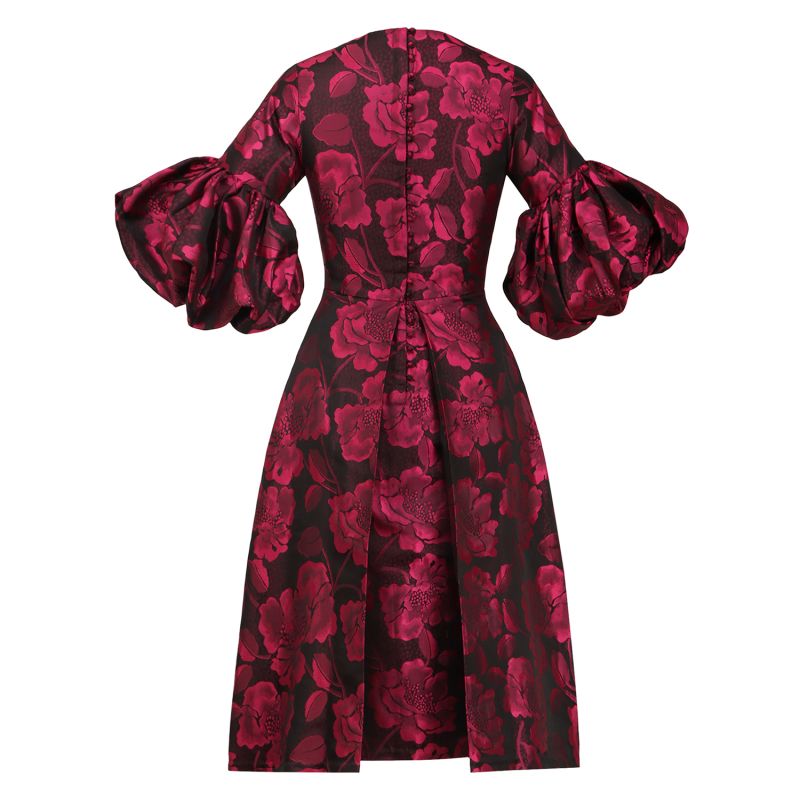 A Pleated Dress With Pink Floral Motifs And Voluminous Puff Sleeves