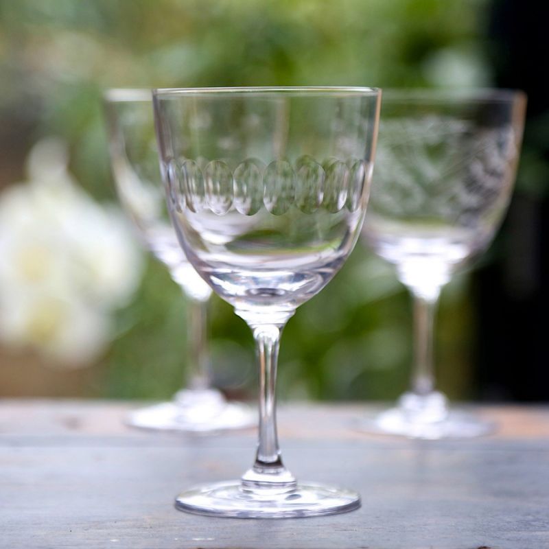 A Pair Of Crystal Wine Glasses With Lens Design image