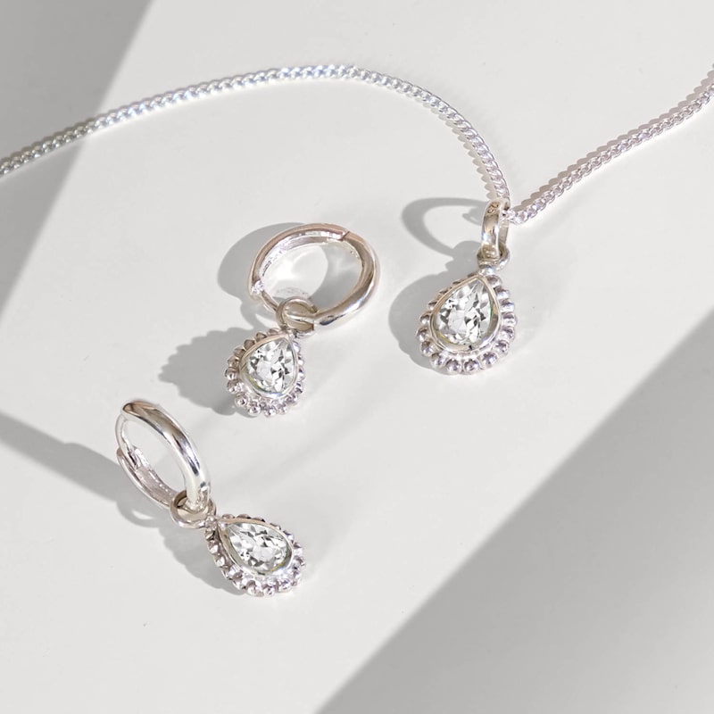 Thumbnail of April Birthstone Sterling Silver Huggie Hoops - White Topaz image