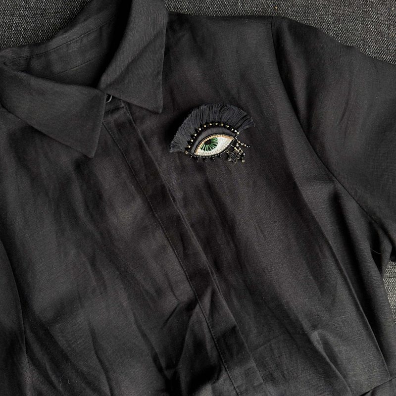 Thumbnail of Black Eye Brooch With Fringe – Witch Charm image