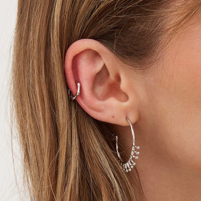 Thumbnail of Bone Shape Hexagonal Huggie Hoop Earring In Sterling Silver - Silver image